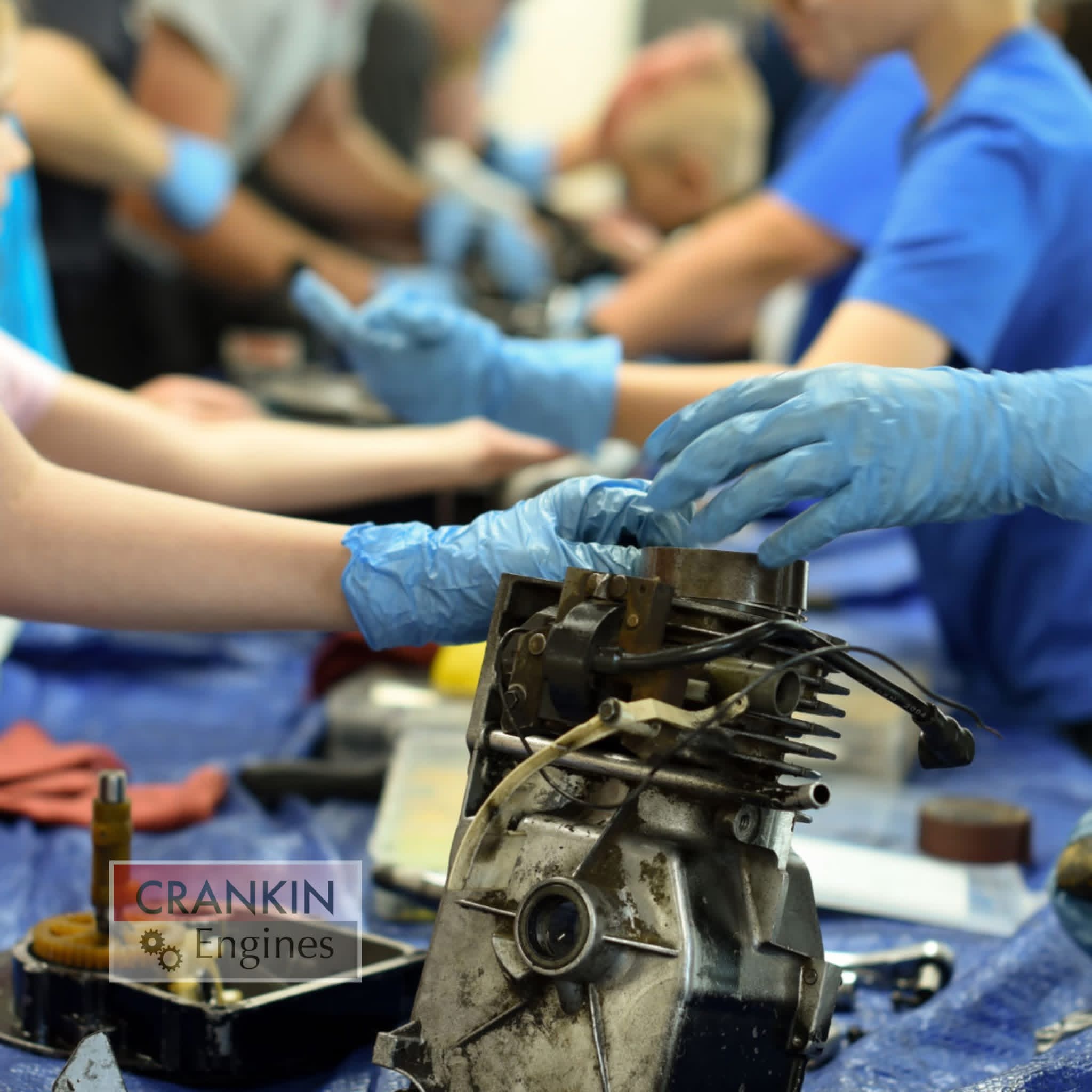 Children hands working on an engine